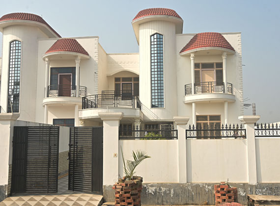 Contemporary luxury home exterior with large glass windows and modern design